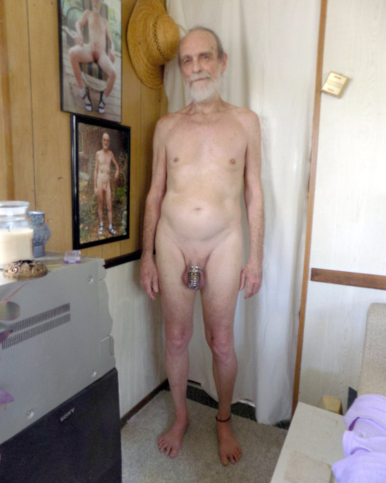 Michael Lowe Wright posed standing naked and barefoot and wearing a chastity cage